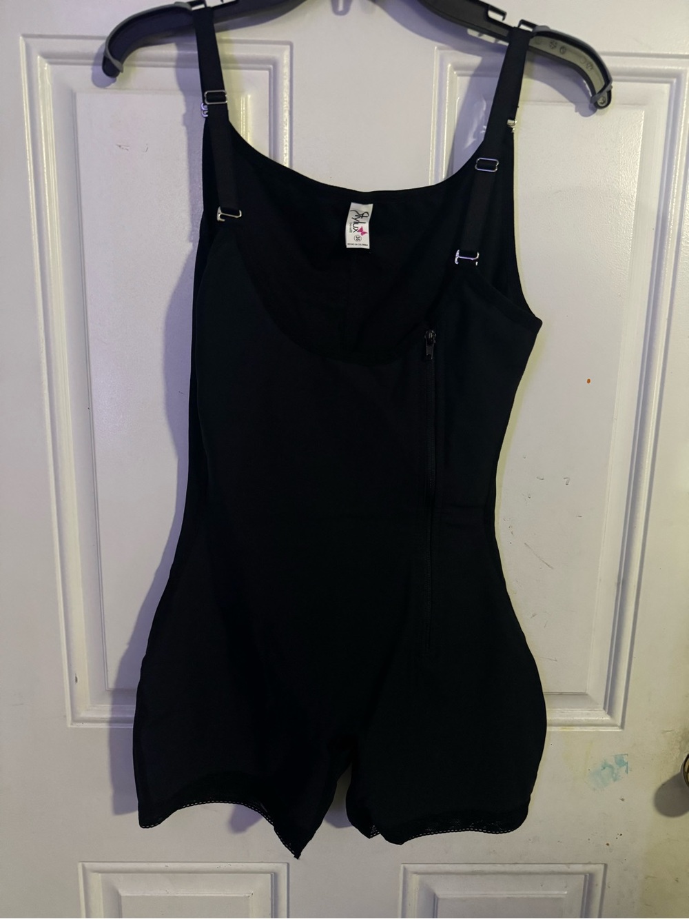Benefit Black Garment with Pink Butterfly Logo